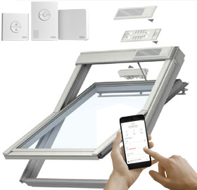 A VELUX window with various electrical accessories, including a phone app being used to control the window.